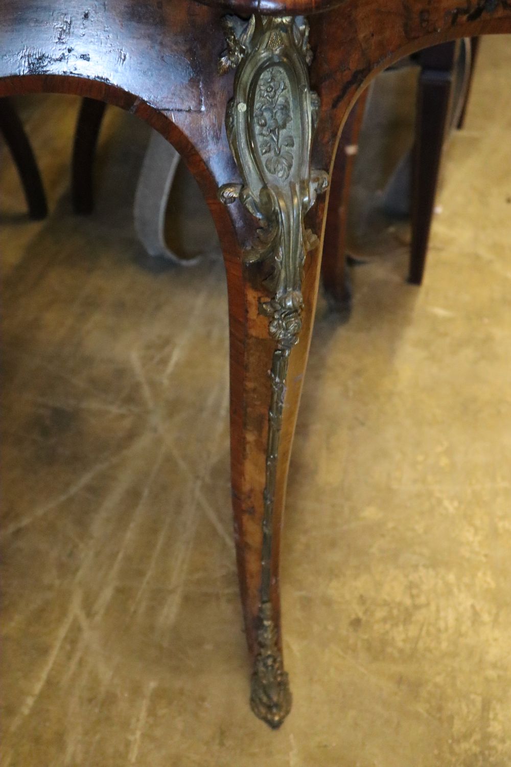 A Victorian figured walnut centre table of serpentine form, with ormolu mounted cabriole legs, width 130cm, depth 89cm, height 74cm